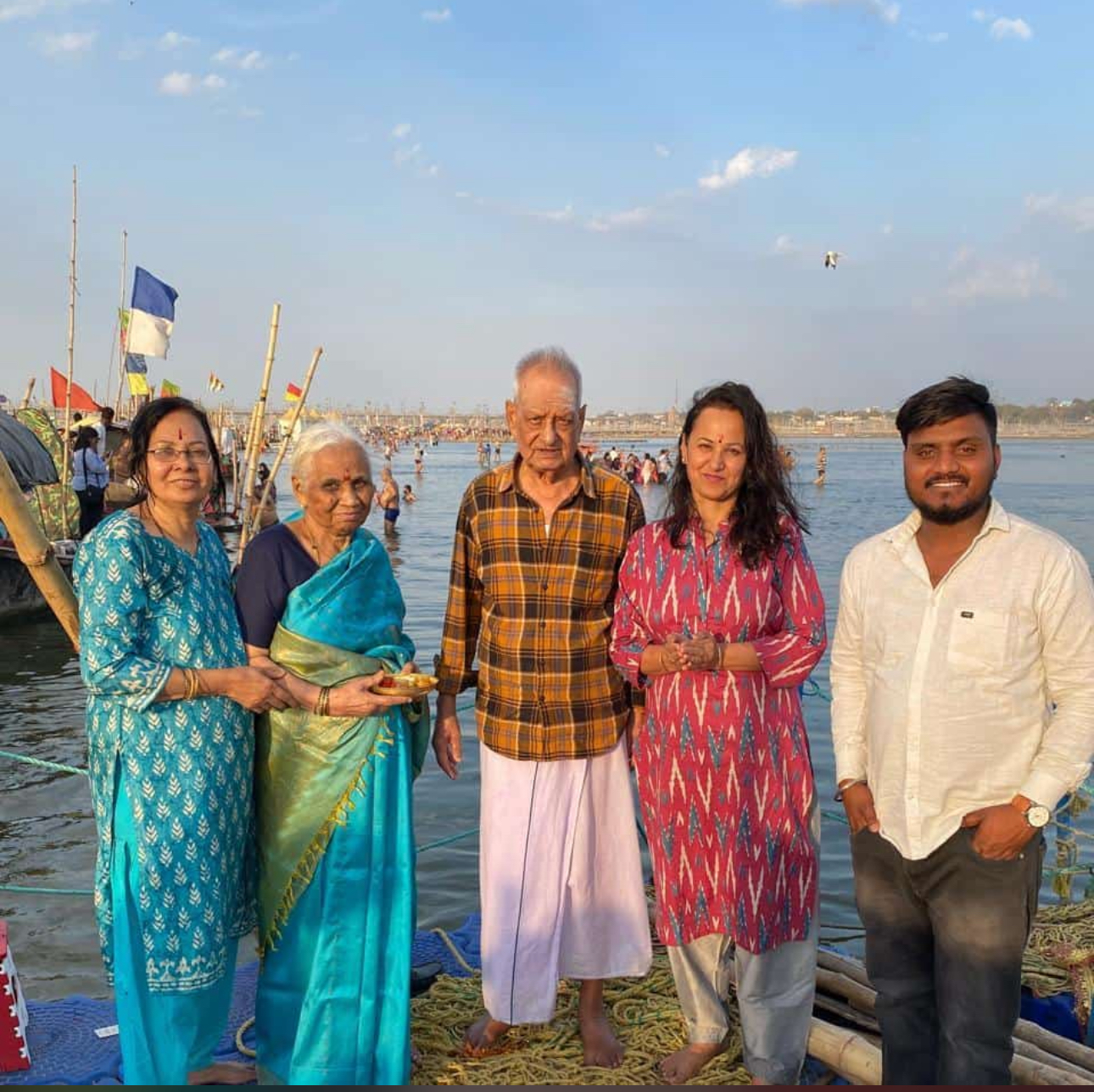 Pilgrim family at the Triveni Sangam, Prayagraj